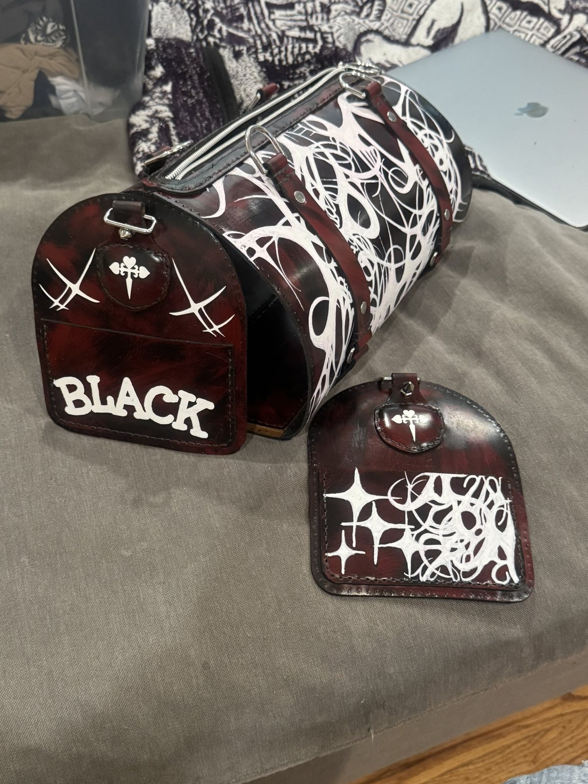 Painted duffle and cap