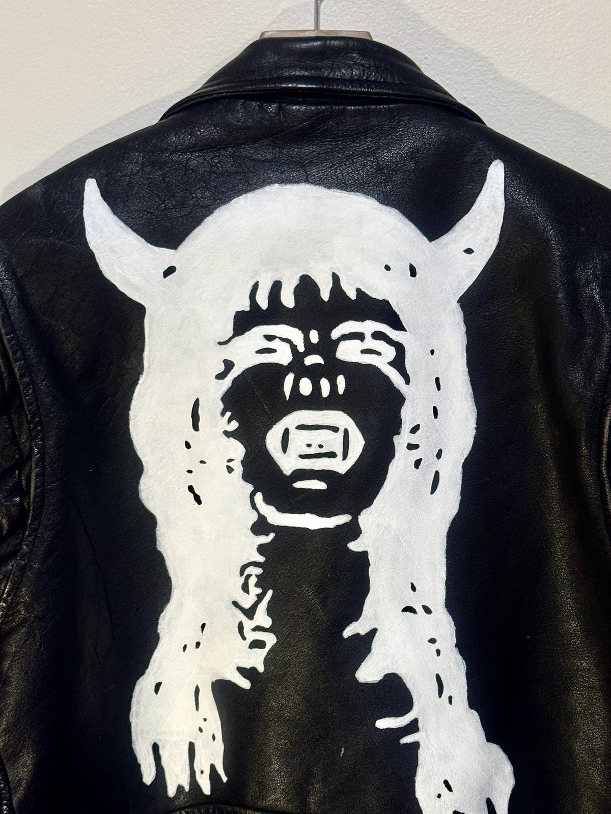 Horned figure, back panel